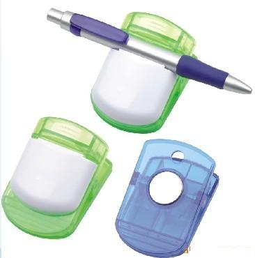 Notepaper clip with magnet and pen holder